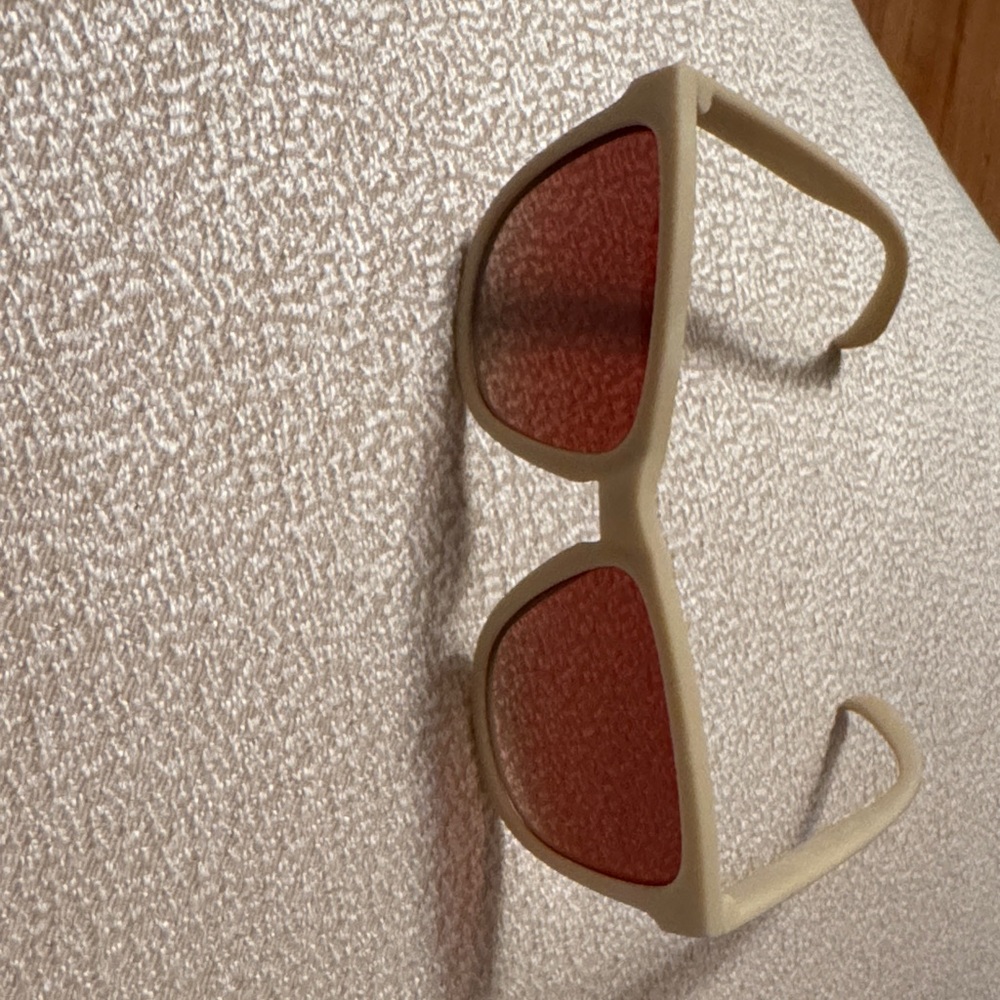 Stylish Beige Sunglasses with Red Lenses